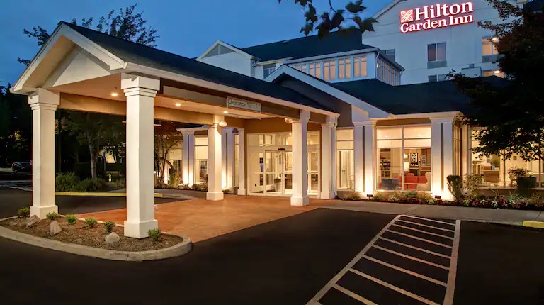 Entrance porte-cochere at Hilton Garden Inn Portland-Beaverton at dusk