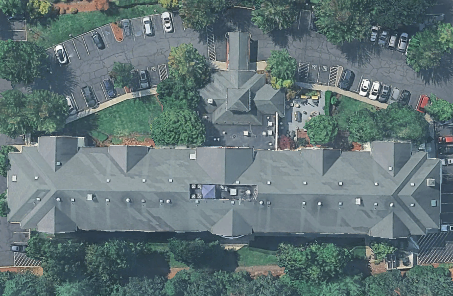 Top-down aerial of the Hilton Garden Inn Portland-Beaverton showing the primary structure footprint and surface parking