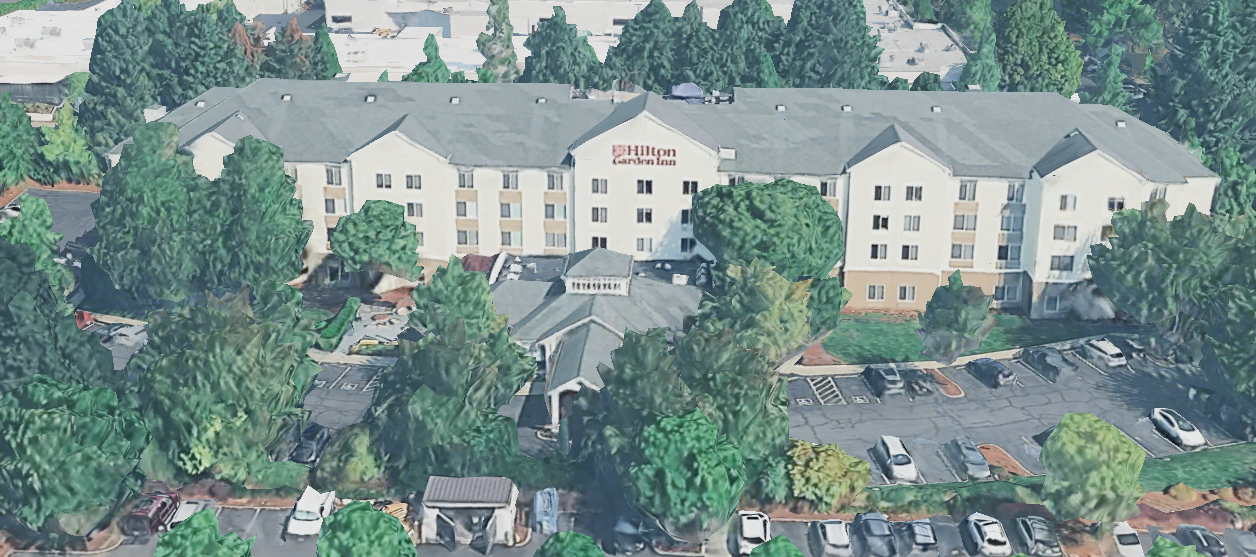 Angled aerial of the property showing surface parking and site perimeter