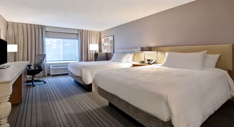 Guest room at Hilton Garden Inn Portland-Beaverton with two queen beds and work desk
